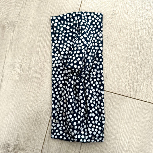 Cintillo azul marino con estrellas